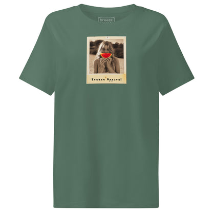 Green t-shirt with graphic of woman holding a watermelon slice in front of her mouth.
