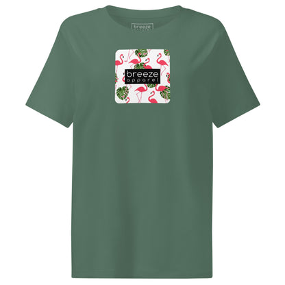 Green t-shirt with pattern of flamingos inside of a square, overlaid with a black box with 'breeze apparel' in white inside.