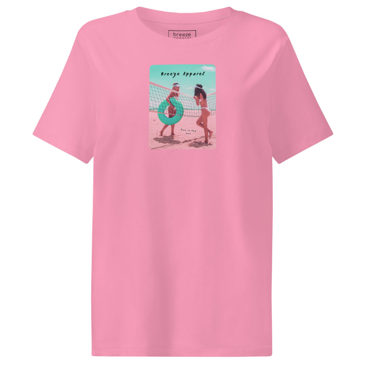 Pink t-shirt with an image of two women in bikinis on the beach, standing by a volleyball net, one holding a swim ring and smiling, the other leaning on the net, with inscription in black of 'breeze apparel' towards the top of the image, and 'fun in the sun' in black on the ground between the women. 
