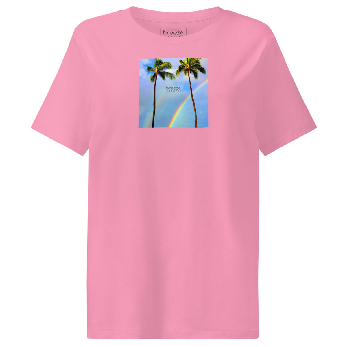 Pink t-shirt with a graphic of palm trees, rainbow, and a clear blue sky in the background. A small, black 'breeze apparel' logo is between the trees.