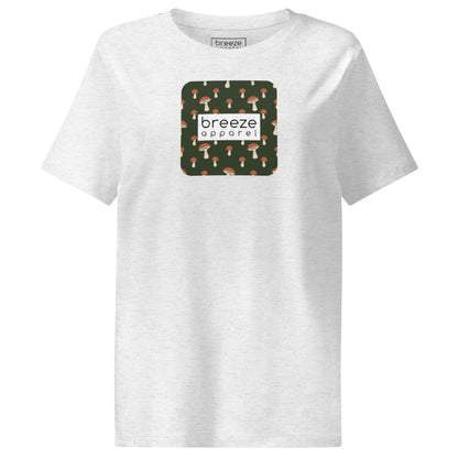 Off-white t-shirt with square graphic of mushrooms set on a green background overlaid with a white rectangle in which 'breeze apparel' is in black.