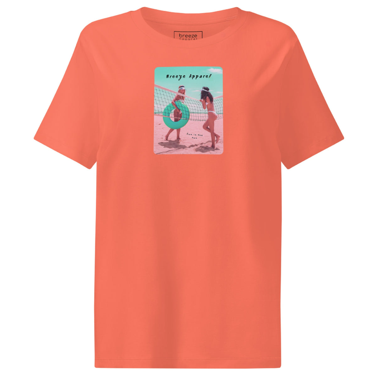 Fiesta-orange t-shirt with an image of two women in bikinis on the beach, standing by a volleyball net, one holding a swim ring and smiling, the other leaning on the net, with inscription in black of 'breeze apparel' towards the top of the image, and 'fun in the sun' in black on the ground between the women. 
