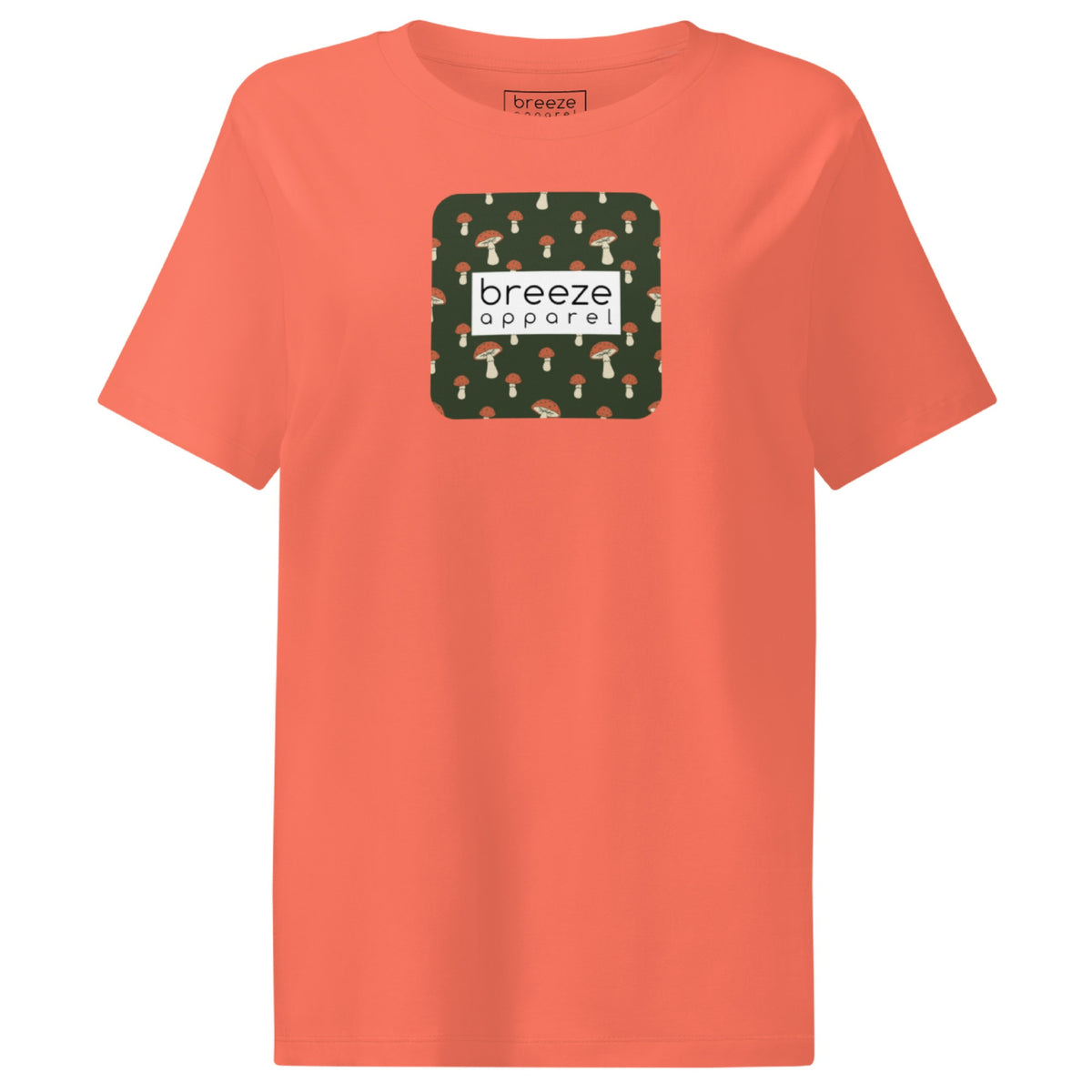 Orange t-shirt with square graphic of mushrooms set on a green background overlaid with a white rectangle in which 'breeze apparel' is in black.