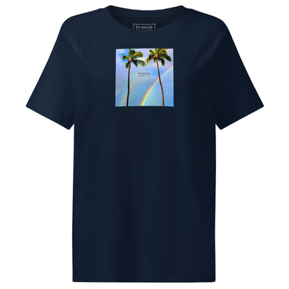 Navy t-shirt with a graphic of palm trees, rainbow, and a clear blue sky in the background. A small, black 'breeze apparel' logo is between the trees.