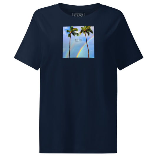 Navy t-shirt with a graphic of palm trees, rainbow, and a clear blue sky in the background. A small, black 'breeze apparel' logo is between the trees.