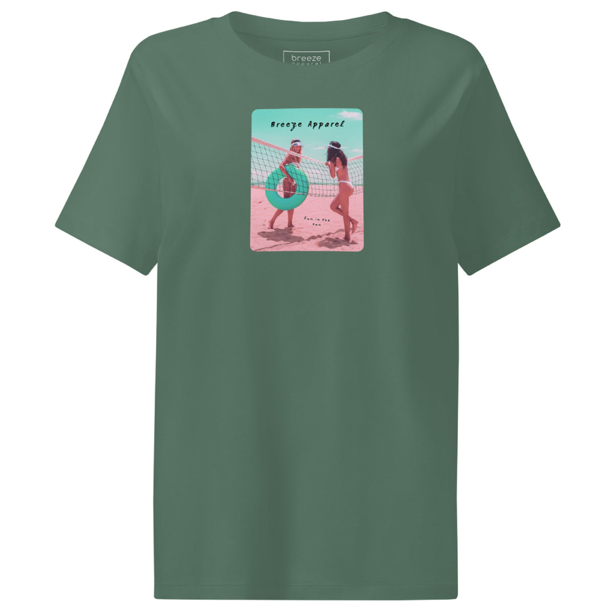 Green t-shirt with an image of two women in bikinis on the beach, standing by a volleyball net, one holding a swim ring and smiling, the other leaning on the net, with inscription in black of 'breeze apparel' towards the top of the image, and 'fun in the sun' in black on the ground between the women. 