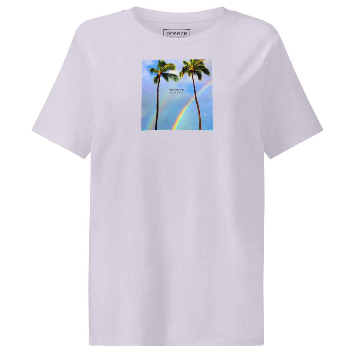 Lavender t-shirt with a graphic of palm trees, rainbow, and a clear blue sky in the background. A small, black 'breeze apparel' logo is between the trees.