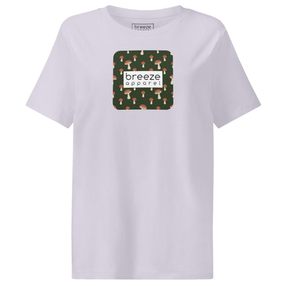 Lavender  t-shirt with square graphic of mushrooms set on a green background overlaid with a white rectangle in which 'breeze apparel' is in black.