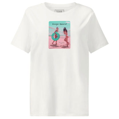 White t-shirt with an image of two women in bikinis on the beach, standing by a volleyball net, one holding a swim ring and smiling, the other leaning on the net, with inscription in black of 'breeze apparel' towards the top of the image, and 'fun in the sun' in black on the ground between the women. 