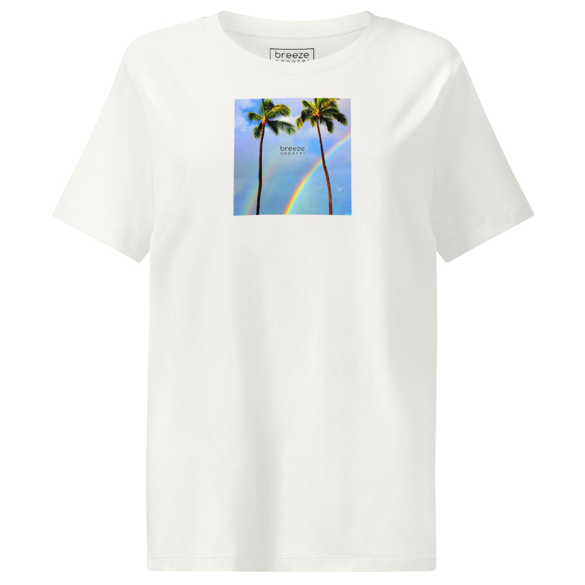 Off-white t-shirt with a graphic of palm trees, rainbow, and a clear blue sky in the background. A small, black 'breeze apparel' logo is between the trees.
