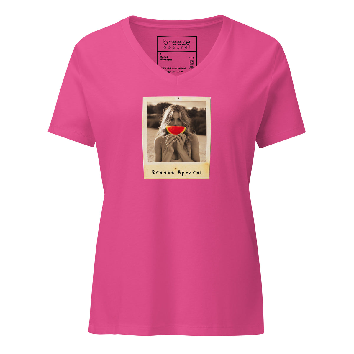 Pink v-neck t-shirt with graphic of woman holding slice of watermelon in front of her mouth.