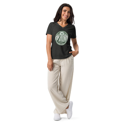 Woman wearing gray, v-neck t-shirt with graphic resembling pyramid from US one-dollar bill.