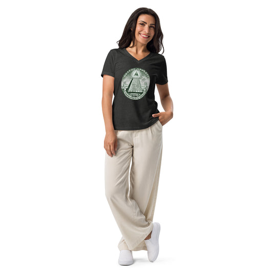 Woman wearing gray, v-neck t-shirt with graphic resembling pyramid from US one-dollar bill.