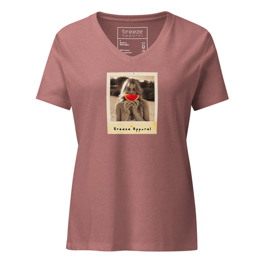 Mauve v-neck t-shirt with graphic of woman holding slice of watermelon in front of her mouth.