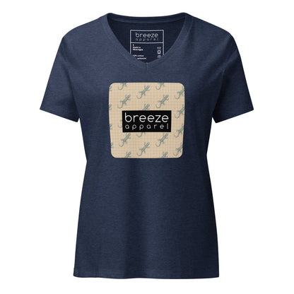 Navy t-shirt with square over chest that contains pattern of green geckos set on beige background, overlaid with black, rectangular logo with white lettering.