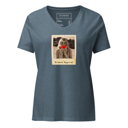Blue v-neck t-shirt with graphic of woman holding slice of watermelon in front of her mouth.