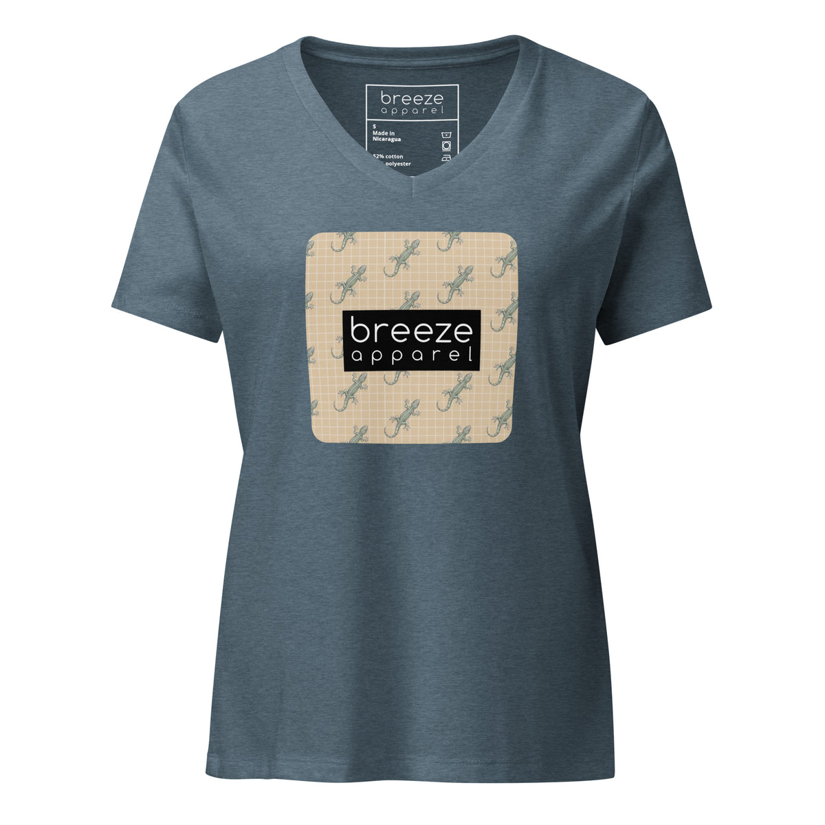 Blue t-shirt with square over chest that contains pattern of green geckos set on beige background, overlaid with black, rectangular logo with white lettering.