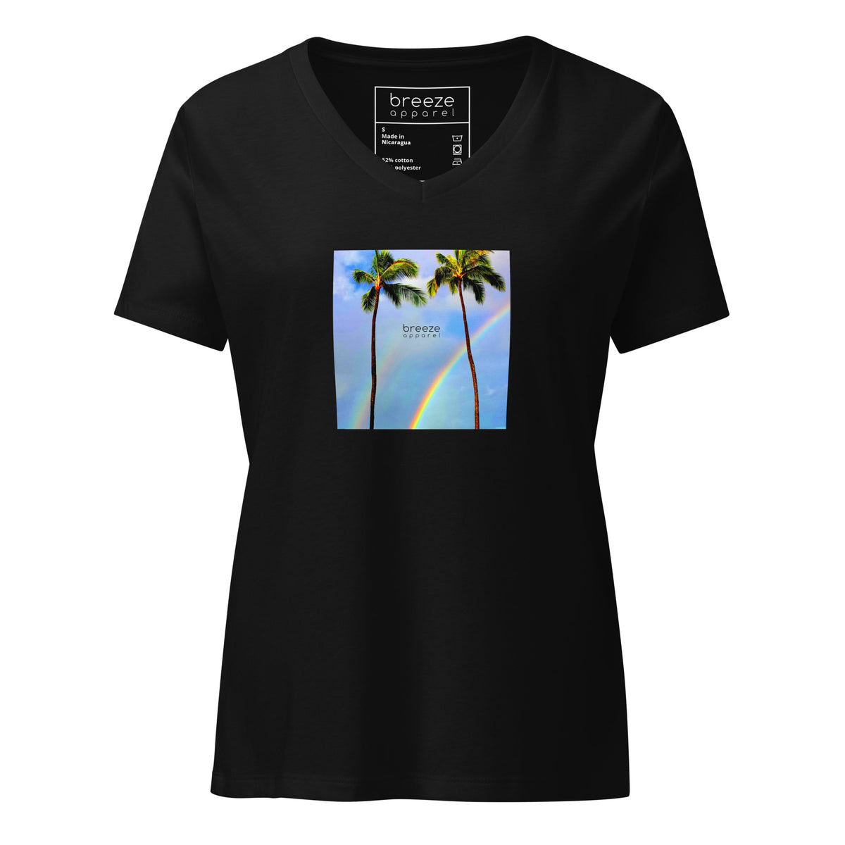 Black v-neck t-shirt with a graphic of palm trees, rainbow, and a clear blue sky in the background. A small, black 'breeze apparel' logo is between the trees. 