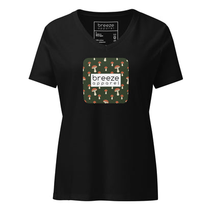 Black v-neck t-shirt with graphic of mushrooms set on a green background and overlaid with white logo.