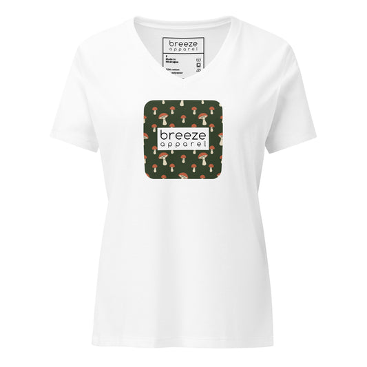 White v-neck t-shirt with graphic of mushrooms set on a green background and overlaid with white logo.